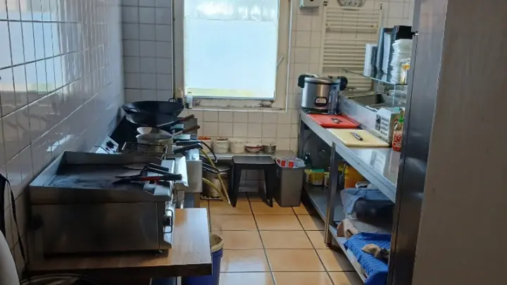 A restaurant cooking line under the extractor hood