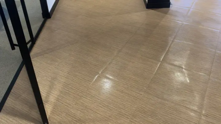 A corridor with glass walls and a clean floor