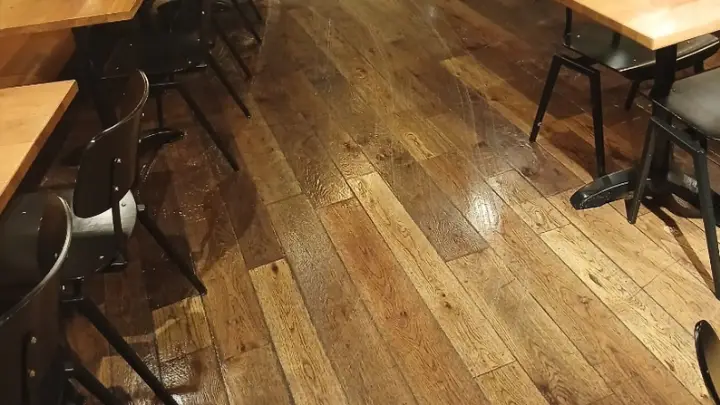 Restaurant tables on a polished oak floor