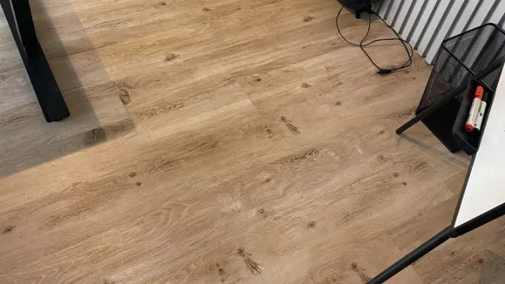 A wooden floor by a radiator