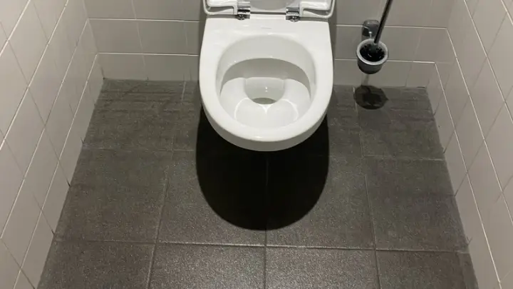 An office washroom, cleaned and restocked