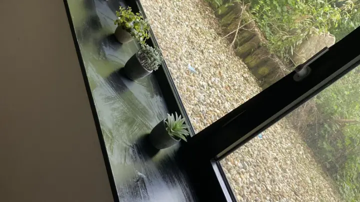 A deep window sill beside the glass