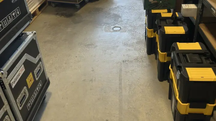A workshop floor with equipment cases