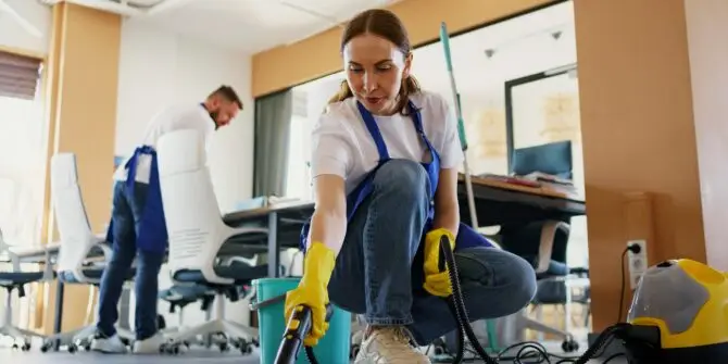 Woman holding a vacuum cleaner during residential cleaning in Maastricht, part of the Elizabet M Cleaning team.